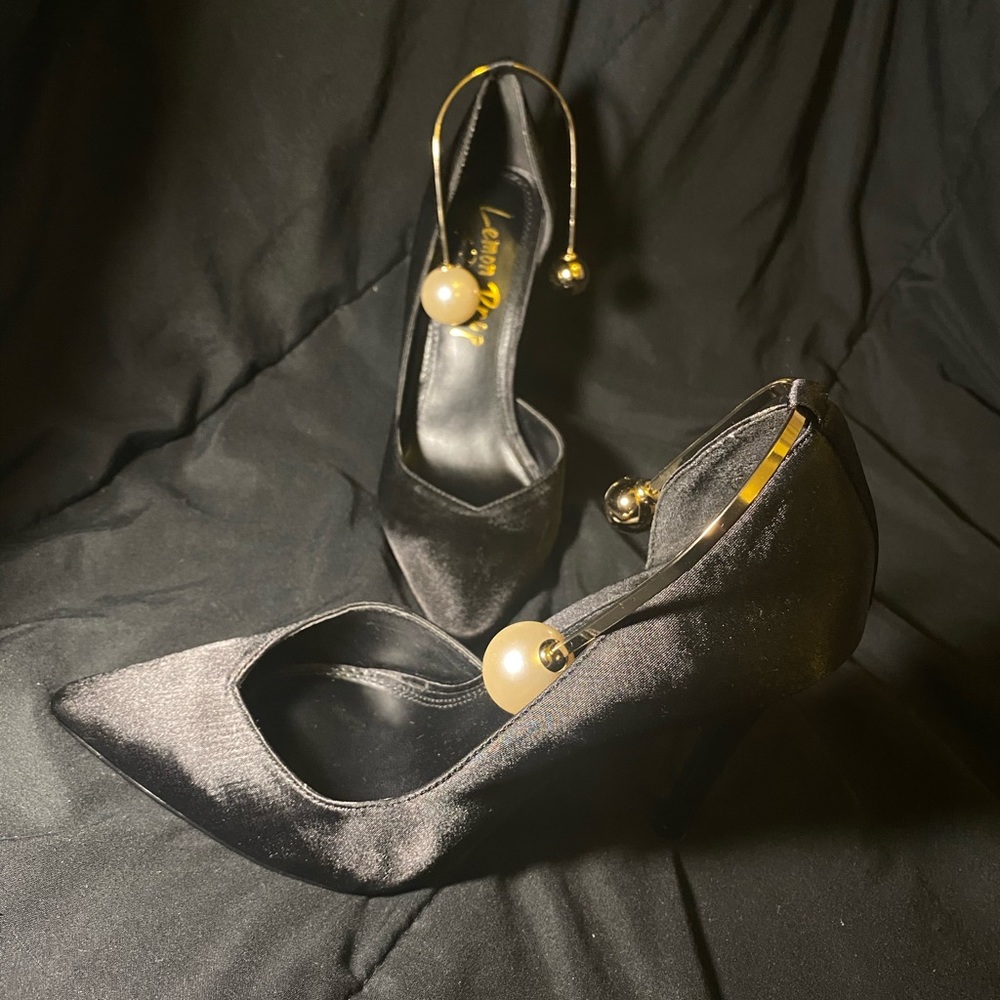 Black triangle pointed high heels